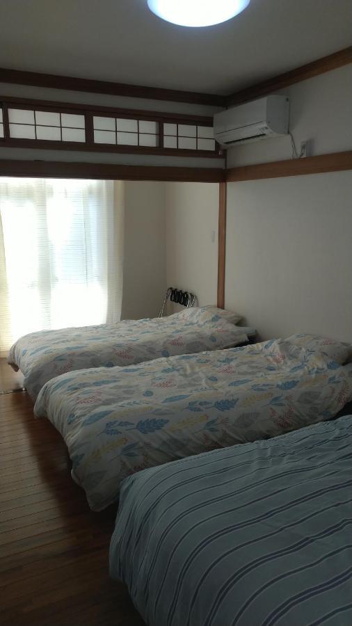 Kami House Hotell Amami Rum bild